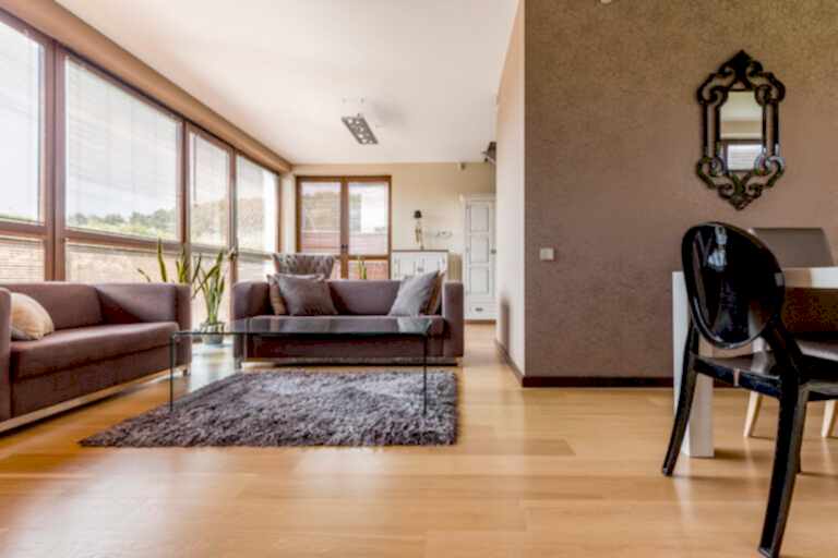 Cozy brown living room with sofas and glass coffee table